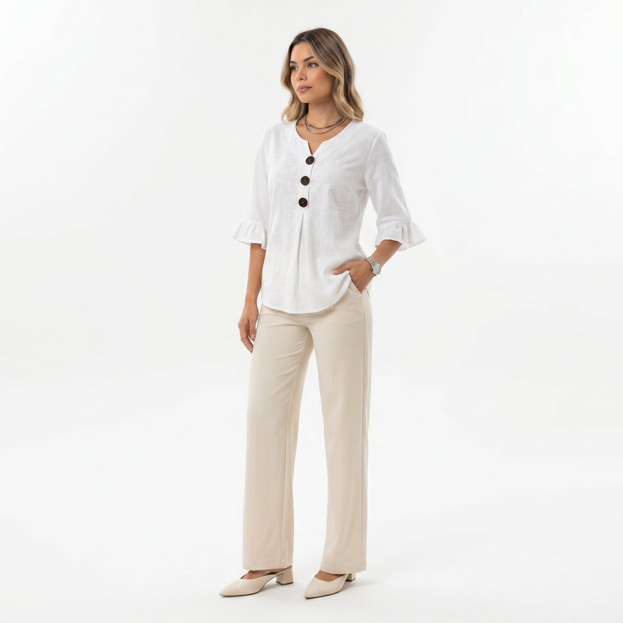Blusa Inés de algodón-lino lisa con botones de madera y volantes