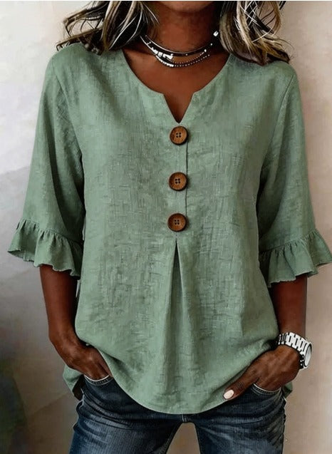 Blusa Inés de algodón-lino lisa con botones de madera y volantes