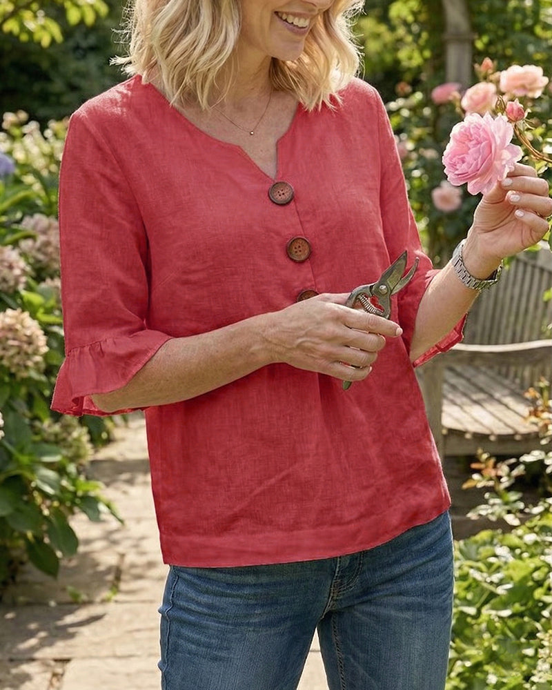 Blusa Inés de algodón-lino lisa con botones de madera y volantes
