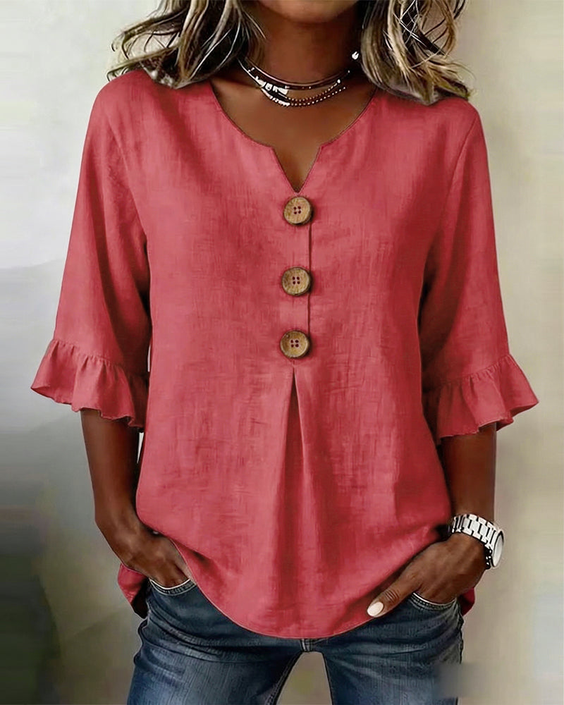 Blusa Inés de algodón-lino lisa con botones de madera y volantes